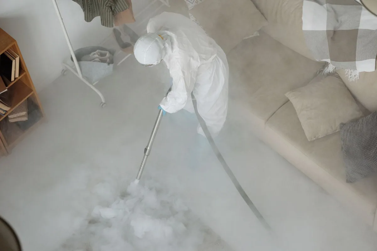 Biohazard cleanup technician in protective equipment, Sorrento, LA